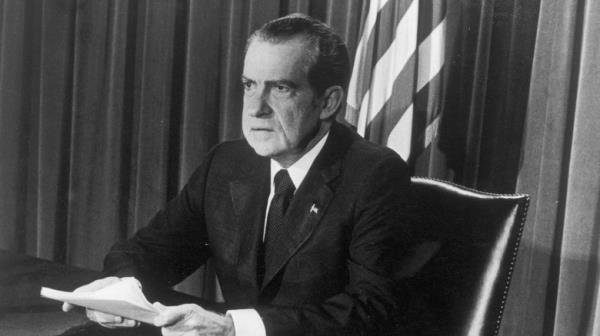 Richard Nixon seated